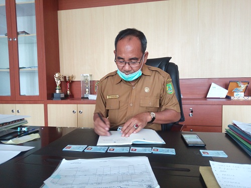 Selain Membatasi Waktu, Disdukcapil Rohil Wajibkan Masyarakat Pakai Masker dan Cuci Tangan